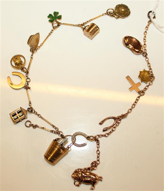 9ct gold charm bracelet set eight 9ct gold charms & a yellow metal bracelet with one15ct & five 9ct charms